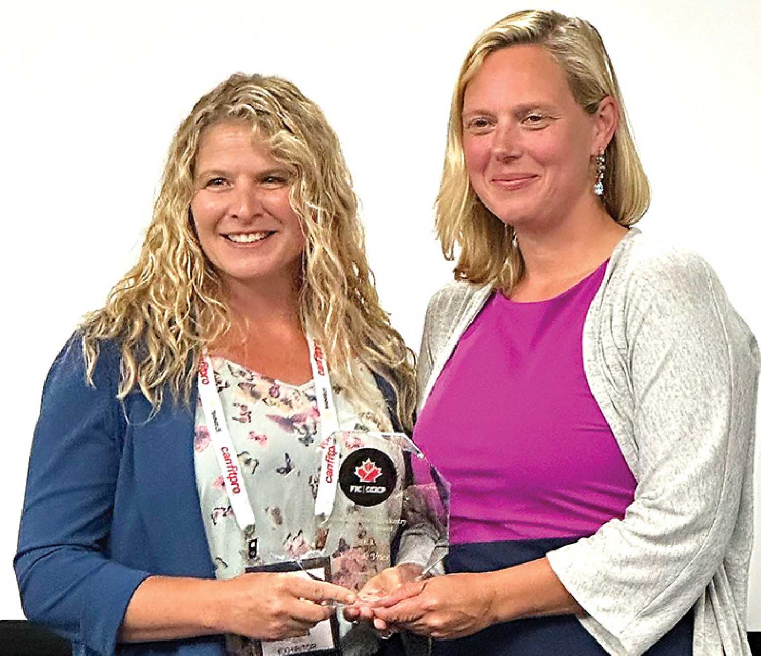 Anytime Fitness Owner Jolene de Vries (left) was awarded the 2023 Canadian Fitness Industry Leadership Award by Sara Hodson, President of Fitness Industry Council of Canada (FIC) at the Canfitpro Global Conference and Tradeshow on Aug. 18. 